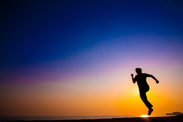 Silhouette of man with courage running to persuit his dream concepts