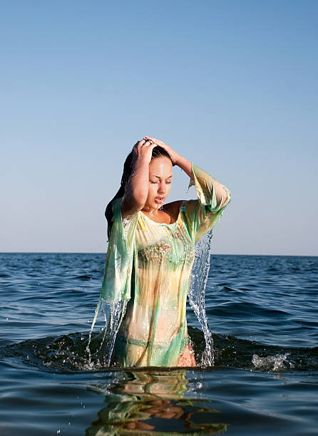 istock young woman on the sea in summer 120090232