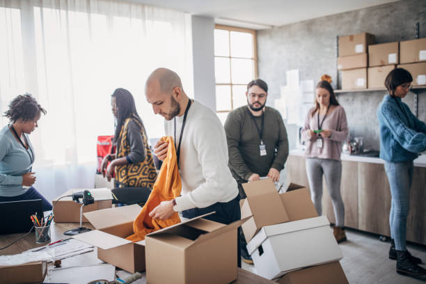 istock Diverse group of people arranging customers orders for drop shipping 1200903471