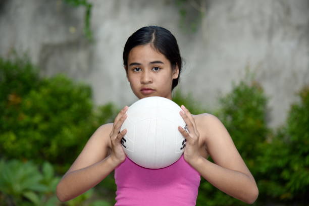 istock Serious Minority Female Athlete With Volleyball 1200903809