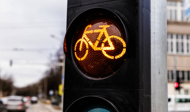 istock Traffic light for cyclists. Yellow light for bycicle lane on a traffic light. 1200905371