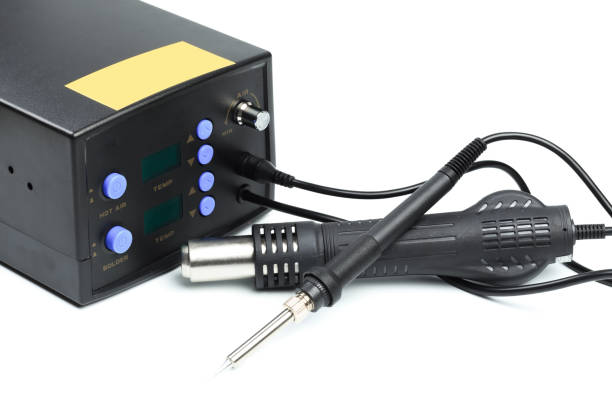 istock Soldering station with LED display, heating control regulator, with hot air gun and soldering iron. Isolated on a white background. 1200907189