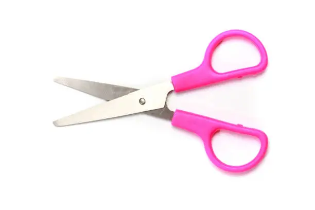 Photo of Pink scissors isolated on white background