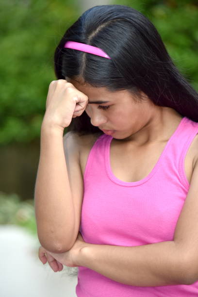 istock A Cute Asian Girl And Sadness 1200909243