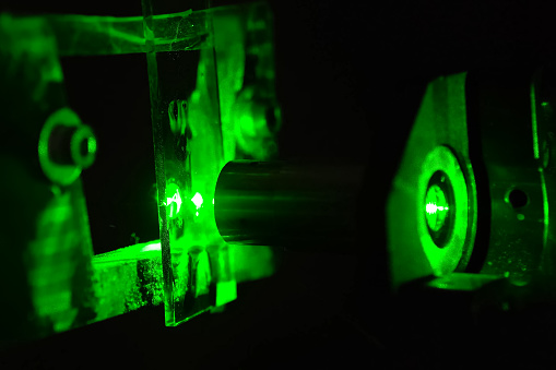 Green light in the laboratory. Green laser in the dark.