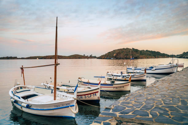 Cadaqués, Catalonia / Spain - November 30th, 2019: Old Mediterranean boats at Port Lligat harbor