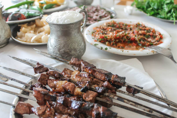 The Turkish liver kebab turkish liver kebab with appetizers on a table gaziantep city stock pictures, royalty-free photos & images
