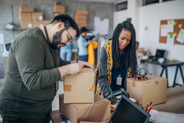 istock Diverse people arranging customers orders for drop shipping 1200911284