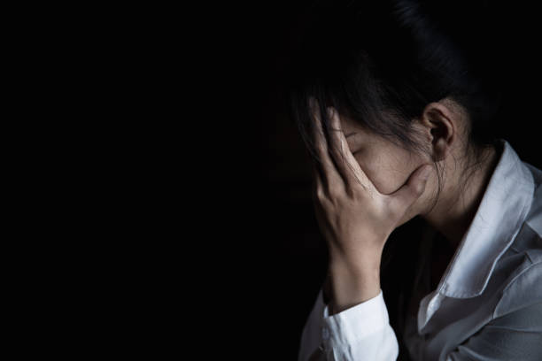 Young woman suffering from a severe depression Young woman suffering from a severe depression victims stock pictures, royalty-free photos & images