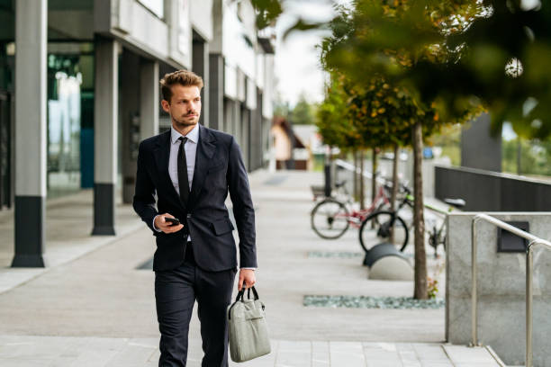 istock Young businessman arriving at work 1200912714