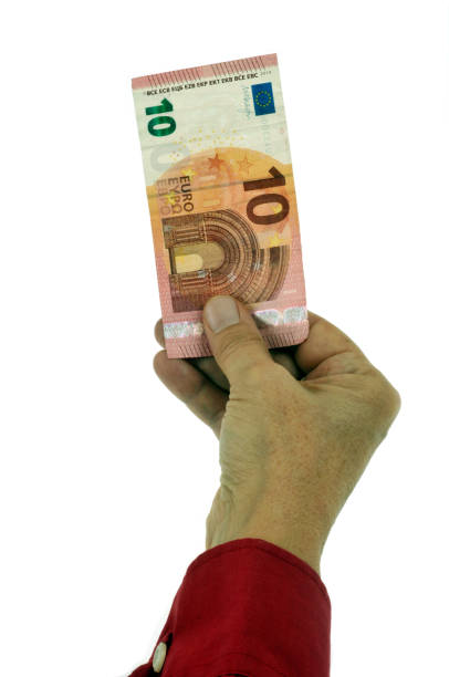 holding a banknote of the European currency in close-up on a white background