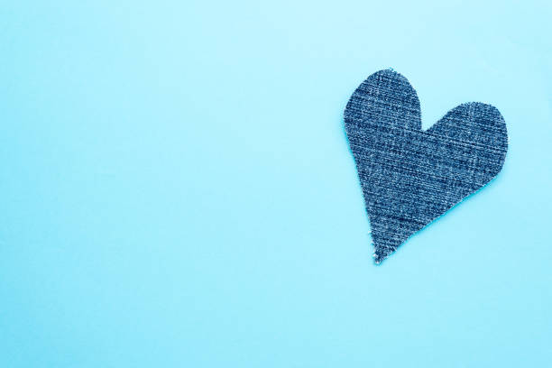 istock Denim heart on blue background. Mockup for greeting card. Copy space 1200914913