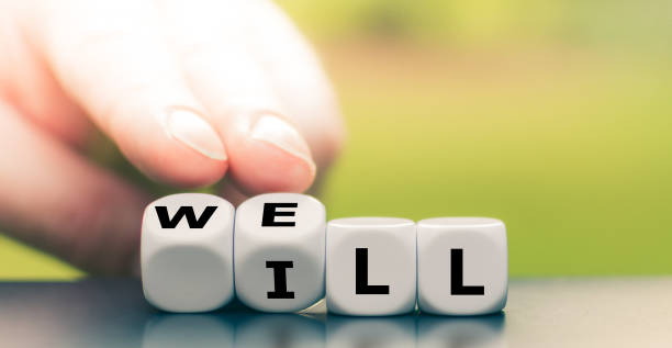 istock Hand turns a dice and changes the word 