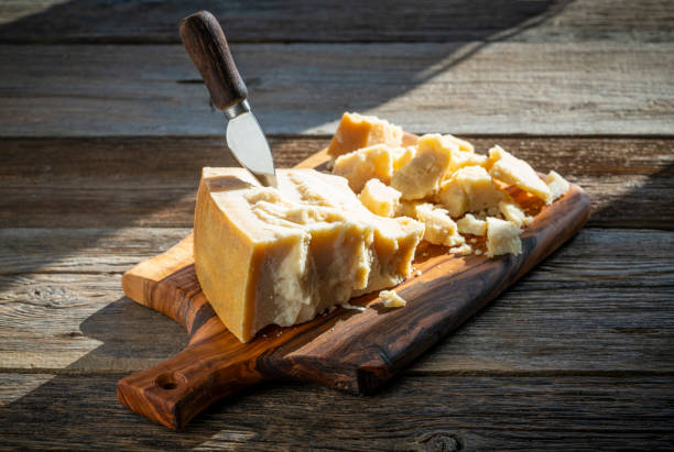 istock Parmesan cheese on cutting board 1200916448