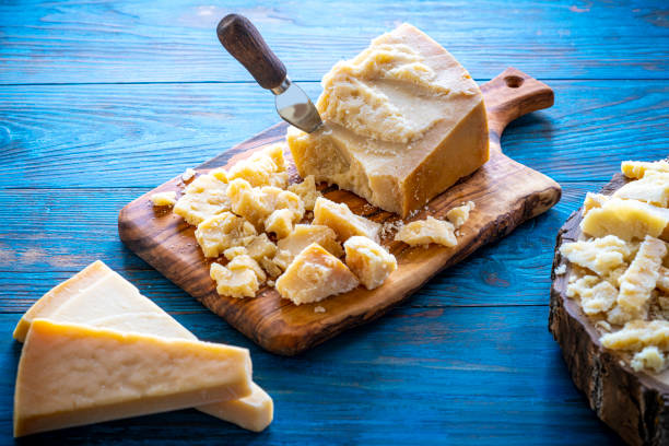 istock Parmesan Reggiano cheese on cutting board 1200916583