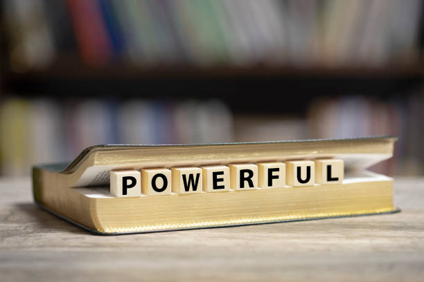 istock Book on desk with Powerful word 1200917911