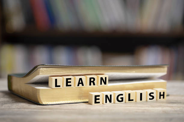 istock Book on desk with Learn English text 1200919440