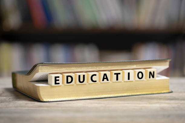 istock Book on desk with Education word 1200920739