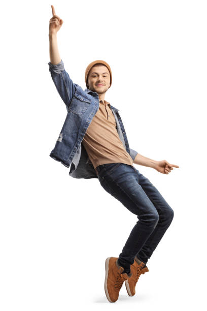 istock Young guy in casual clothes dancing on tiptopes 1200922681