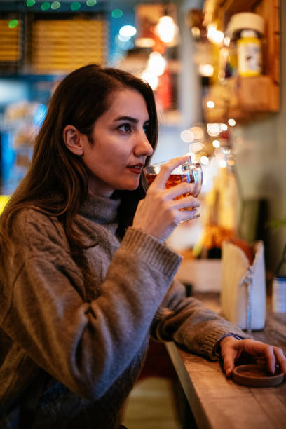 istock Brunette Woman Drinking Tea 1200922800
