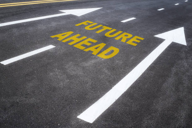 istock Future ahead word on asphalt road with arrow 1200922919