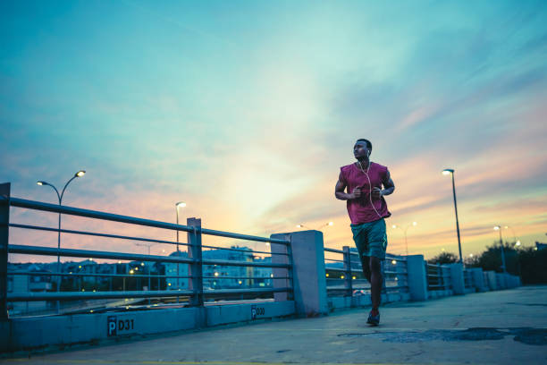 istock Young African american athlete jogging outdoor 1200923063