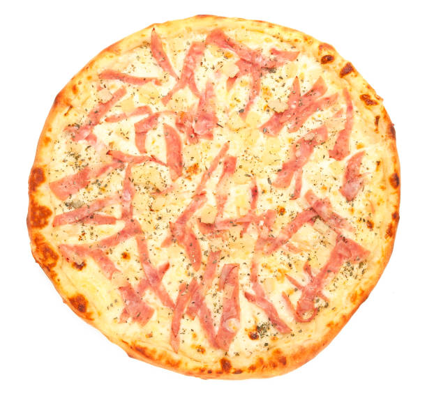 istock Pizza with pineapple, mozzarella and ham. A piece is cut off from pizza. View from above. White background. Isolated. 1200923086
