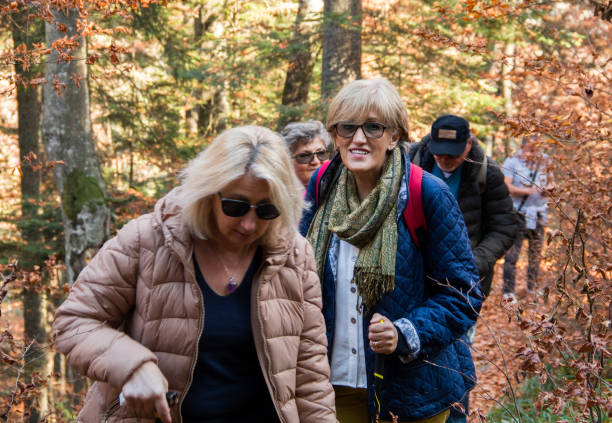 istock Group of people enjoying an autumn walk 1200925547
