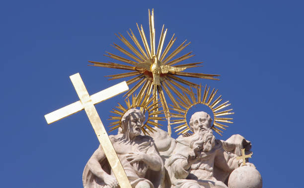 istock religious statue with cross at Matthias church. 1200925884