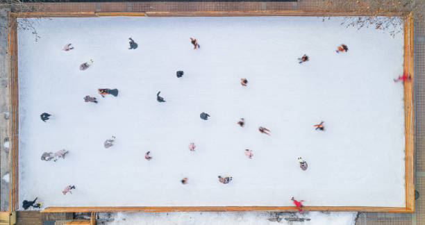 istock Ice skating. Aerial view directly above an ice rink. 1200926340