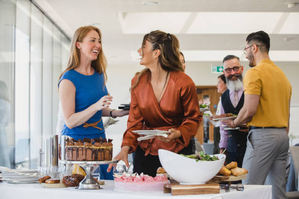 istock Cheerful female colleagues chatting during business lunch 1200927201