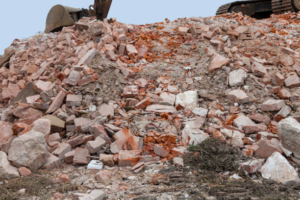 istock digger on heap of stones 1200927421