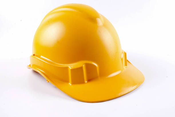 istock Yellow hardhat safety helmet on white background 1200930271