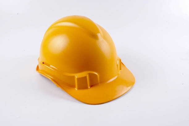 istock Yellow hardhat safety helmet on white background 1200930293