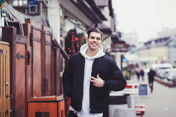 istock young man walking around the city 1200930748