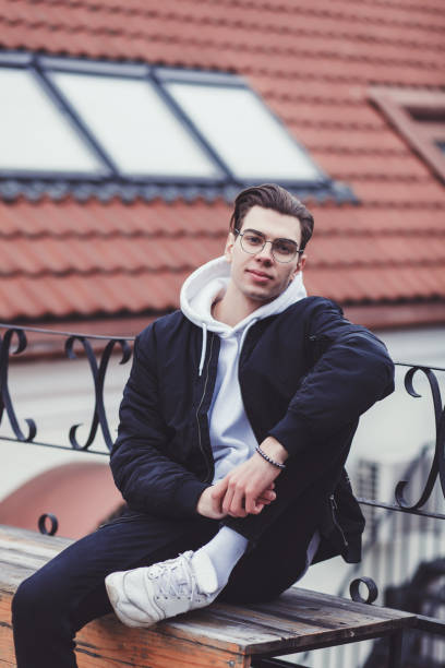 istock stylish man in a jacket and white sneakers 1200930799