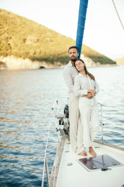 istock Couple relaxing on sailing 1200931654