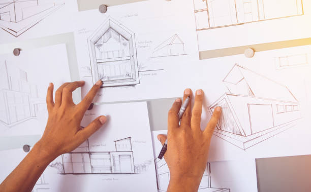 istock Architect Designer Engineer sketching drawing draft working Perspective Sketch  design house construction Project 1200931858