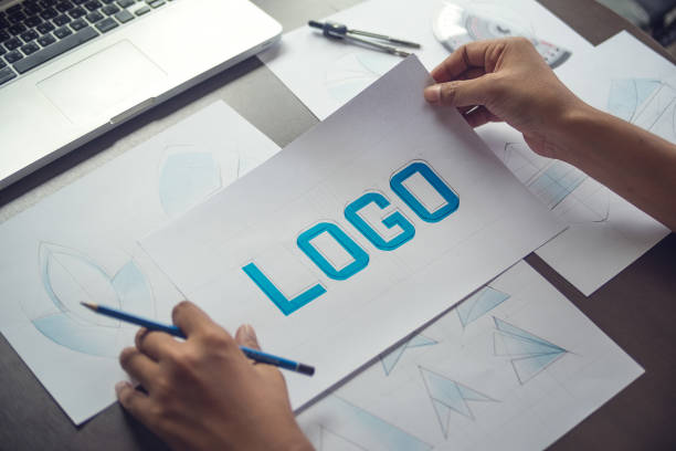 istock Graphic designer creative design sketch drawing logo Trademark brand Workspace 1200931872