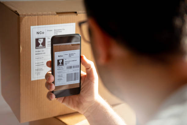 istock Delivery service, scanning a shipping label 1200932894