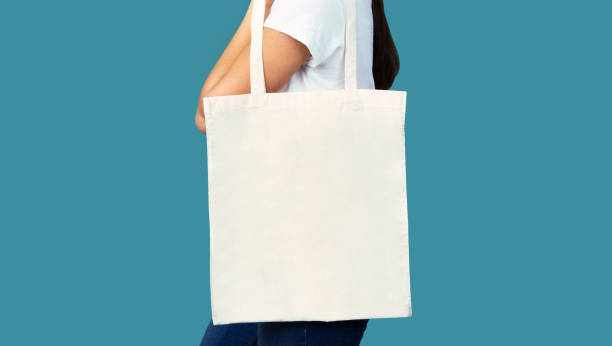 istock Girl Holding White Eco Bag Standing In Studio, Panorama, Cropped 1200935612