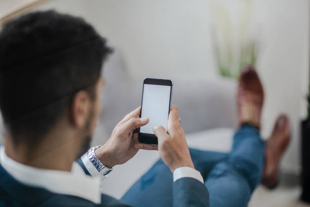 istock Businessmen is looking at phone 1200935911