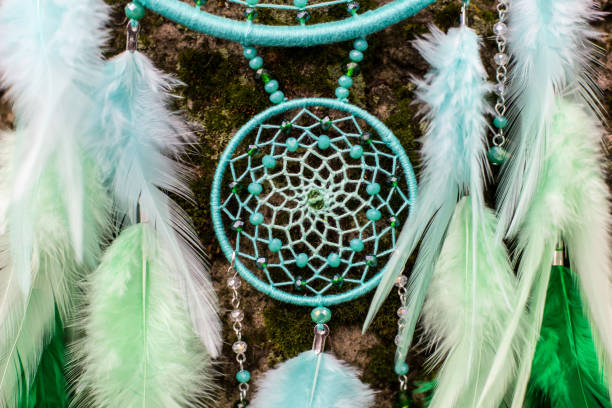 istock Handmade dream catcher with feathers threads and beads rope hanging 1200937283