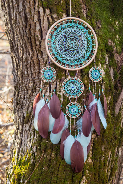 istock Handmade dream catcher with feathers threads and beads rope hanging 1200937296