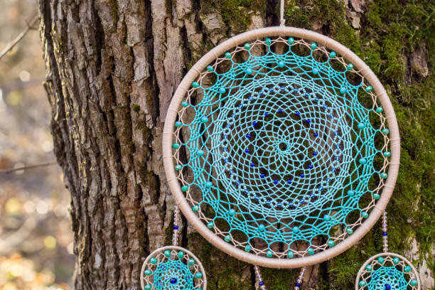 Handmade dream catcher with feathers threads and beads rope hanging