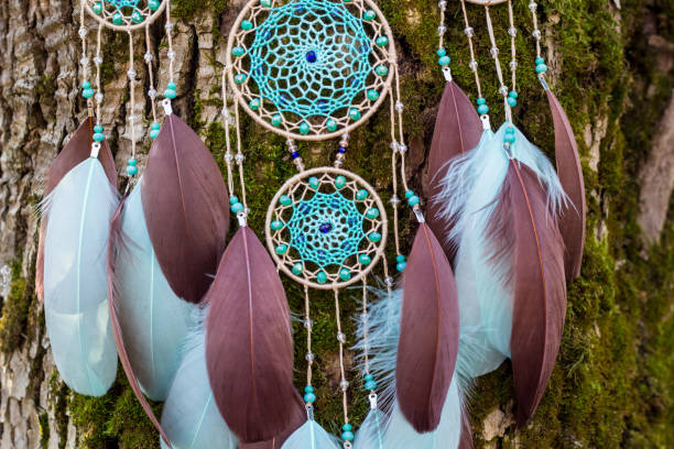 istock Handmade dream catcher with feathers threads and beads rope hanging 1200937343