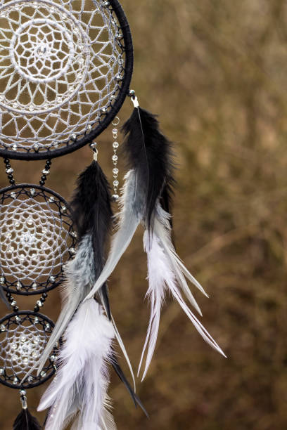 istock Handmade dream catcher with feathers threads and beads rope hanging 1200937379