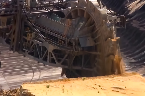work of a bucket wheel excavator in a quarry. Ore mining in a qu