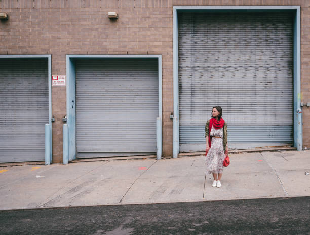 istock Young woman with a red scarf 1200937836