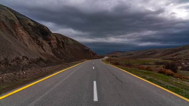 istock Winding country road in mountains 1200939838